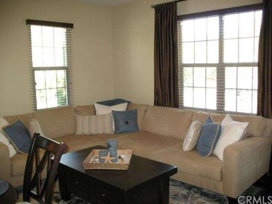 This inviting and spacious living room provides pl