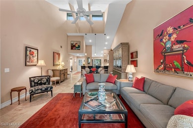 Living room featuring a towering ceiling, a ceilin
