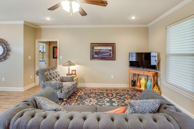 Doorway leads to hallway with 2 bedrooms and bath.