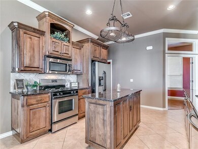 Notice the hanging light fixture above the Island.