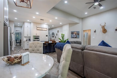 Dining area with light wood-style flooring, recessed lighting, and ceiling fan