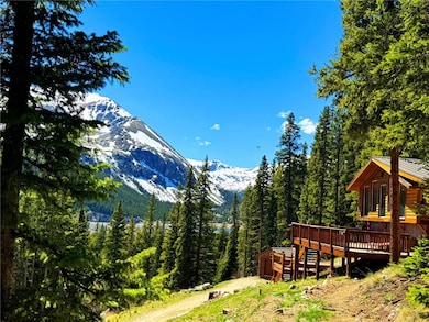View of yard featuring a deck with mountain view a