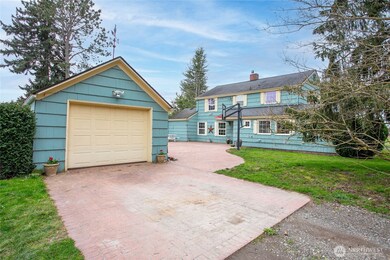 Detached single car garage and load of parking in the back.