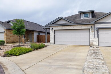 View of front of property with stone siding, roof