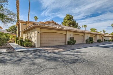 View of home's exterior with stucco siding and a t