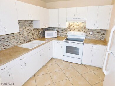 Kitchen With New Countertops, Tile Backspash, and