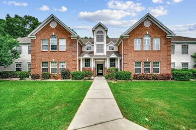 View of property with a front lawn