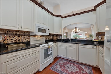 Kitchen w/granite countertops, wood floors