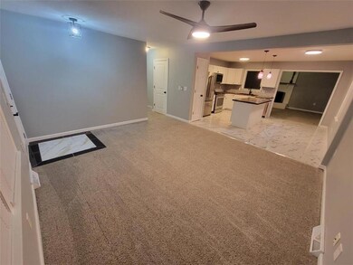 View of the front living room to the kitchen.