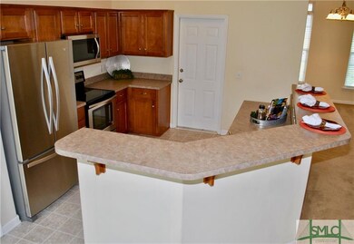 Eat-in kitchen bar is extremely large and could ea