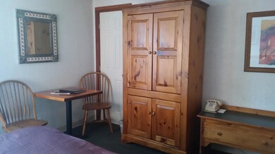 armoire with flat screen tv inside