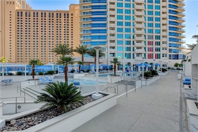 View of property with a community pool