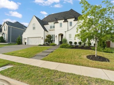 Front of the home featuring beautifully painted wh