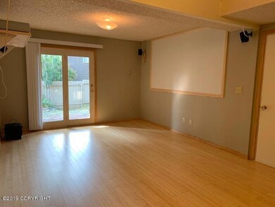 Family room with slider to fenced yard