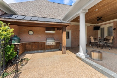 Elevate your entertaining with this exceptional covered patio and outdoor kitchen—where function meets finesse. Designed for year-round enjoyment, this inviting space features recessed lighting, ceiling fans, and ample counter space for prep and serv
