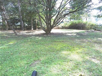 Large Rear yard bordered by Split Rail Fence