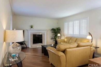 Beautiful living room with wood floors, marble fir