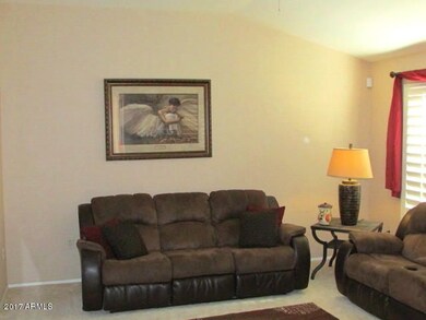 Living Room w/vaulted ceiling & shutters