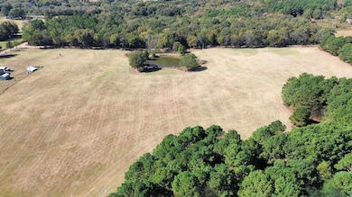 Aerial view of property and surrounding area with rural landscape