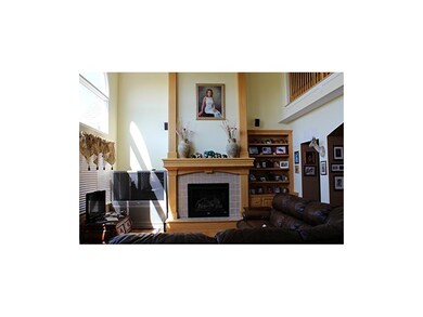 Great Room with gas fireplace, hardwood floors and