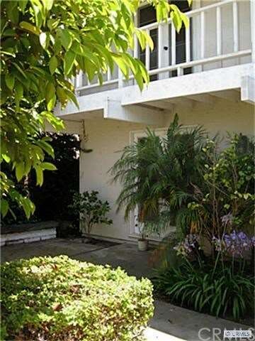 View of courtyard and balcony from gate.