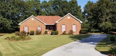 Ranch-style house featuring a front yard