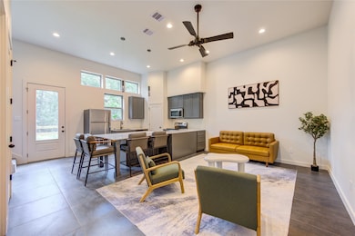 Tall 12’ ceilings and abundant windows provide a s