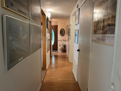 Hall featuring light hardwood / wood-style floors,