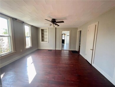 Wood floored dining room with built in features, c