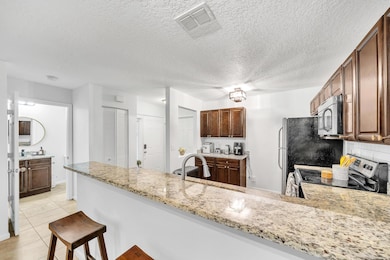 1627 Woodbridge Lakes Cir, West Palm Beach, FL 33406 - photo 6