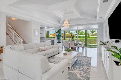 Living room with a chandelier, healthy amount of n