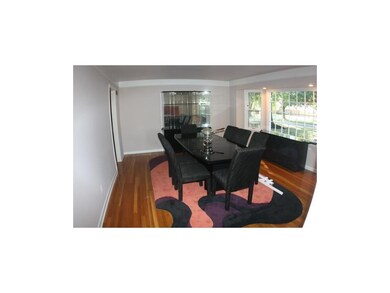 Spacious dining room (easily seats 10) with bay wi