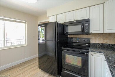Kitchen with light hardwood / wood-style flooring,