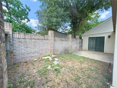 Fenced backyard featuring a patio