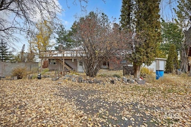 Rear view of property with a deck and stairs