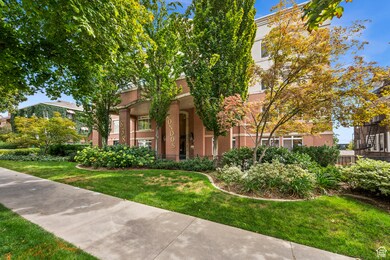 View of front facade featuring brick siding and a front yard