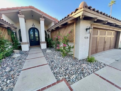 9220 Front walk way to Iron door