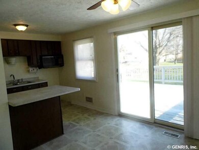 Kitchen. Ceiling fan with light. Slider to the lar