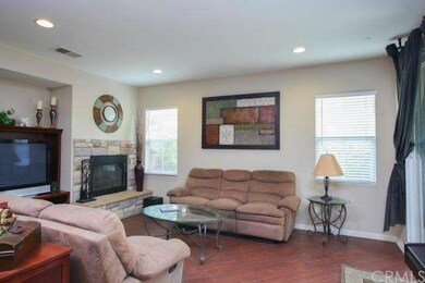 Elevated built in stone fireplace and entertainmen