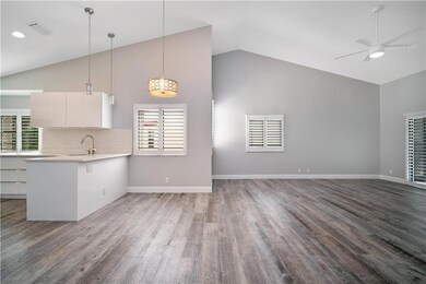 Great room, plantation shutters, contemporary LED