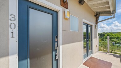 Entrance to property featuring stucco siding