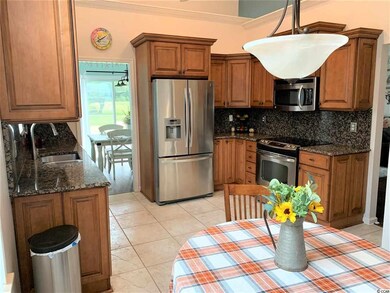 Breakfast nook overlooks the spacious kitchen!