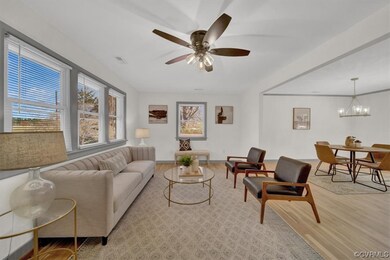 Living room featuring natural light and a ceiling