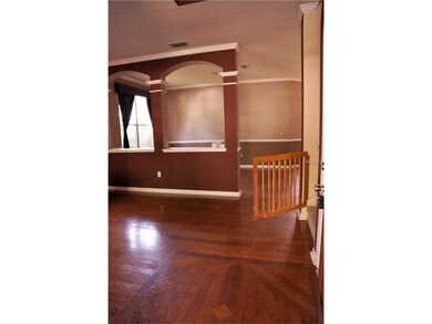 Front room and dining room behind half wall