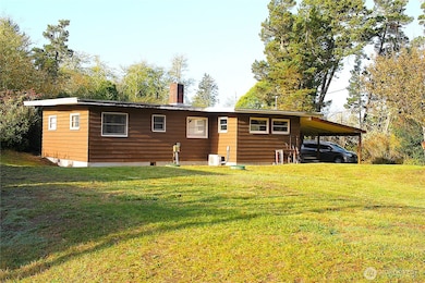 Rear view of the home with --