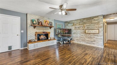 Open concept living room with fresh pain, laminate