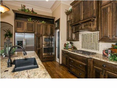 Kitchen has large granite island