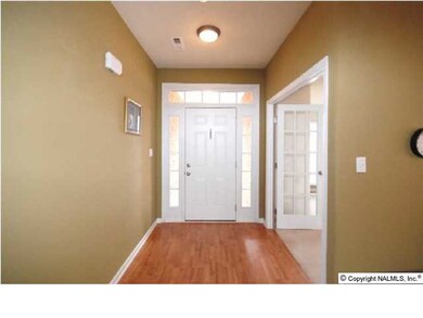 AS YOU ENTER THE 6 X 5 FOYER, THE DOUBLE AND OVERHEAD SIDELIGHT FRONT ENTRANCEWAY AND HARDWOOD FLOORS EXHIBIT THE BEAUTY THIS HOME OFFERS.