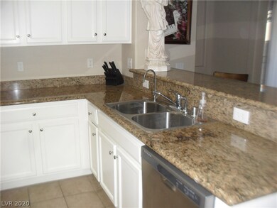 Huge granite kitchen with modern white cabinets