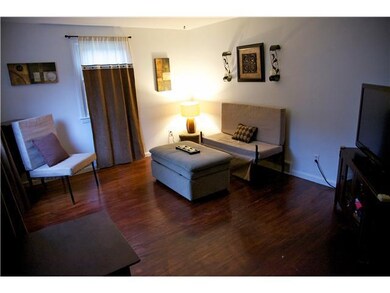 Living Room This room has hardwood flooring and co